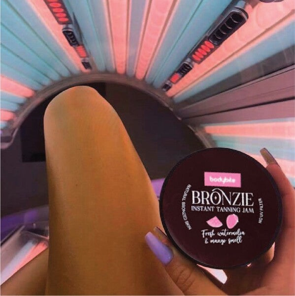 Bodybite BRONZIE Instant Tanning Jam with Watermelon and Mango in a tanning bed setting