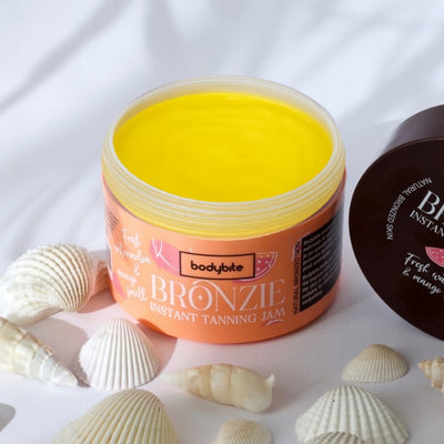 Bodybite BRONZIE Instant Tanning Jam with Watermelon and Mango in a vibrant tub, perfect for sun-kissed skin